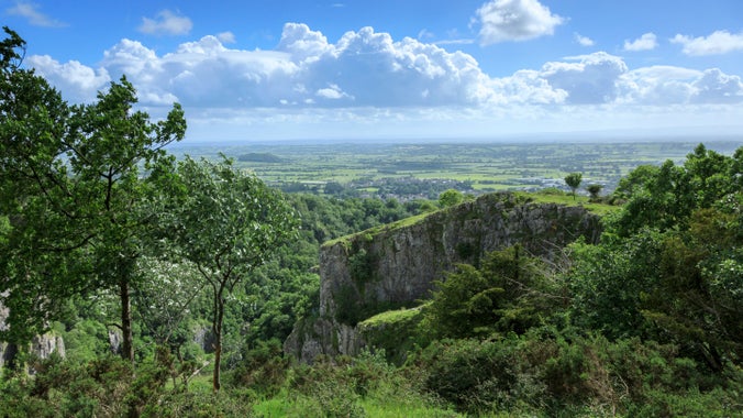 A view across the countryside at Cheddar Gorge with cliffs in the foreground